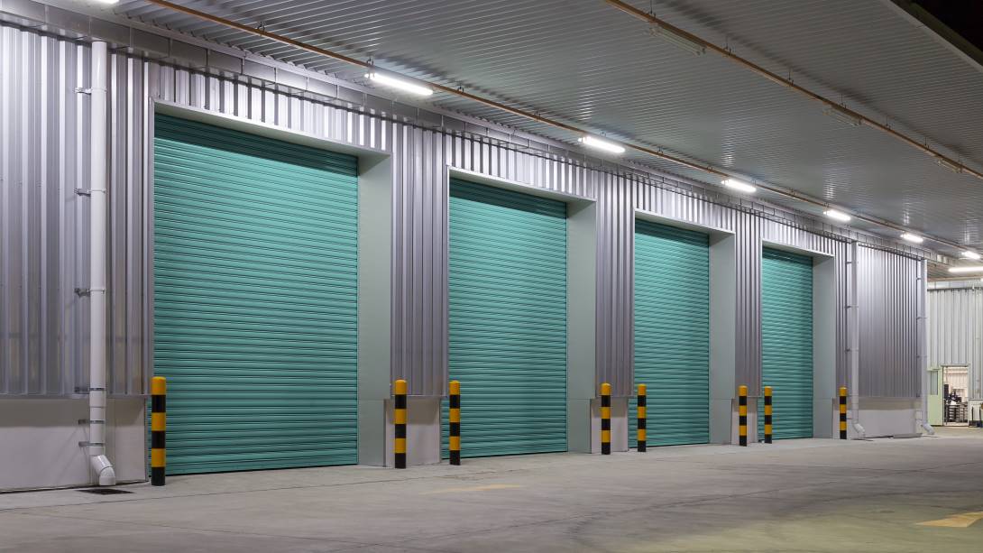 Shutter door or roller door and concrete floor outside factory building use for industrial background.